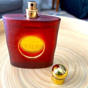 YSL Opium perfume. 3 oz. No box. Spritzed a few times.
